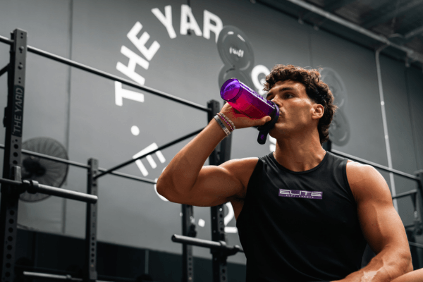 Athlete drinking electrolytes from a shaker
